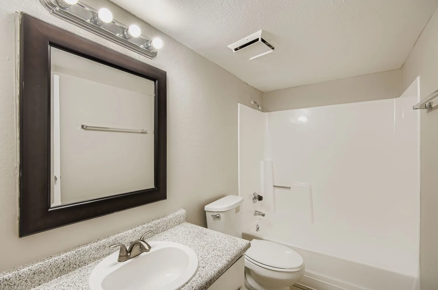 Bathroom with vanity and tub/shower combo