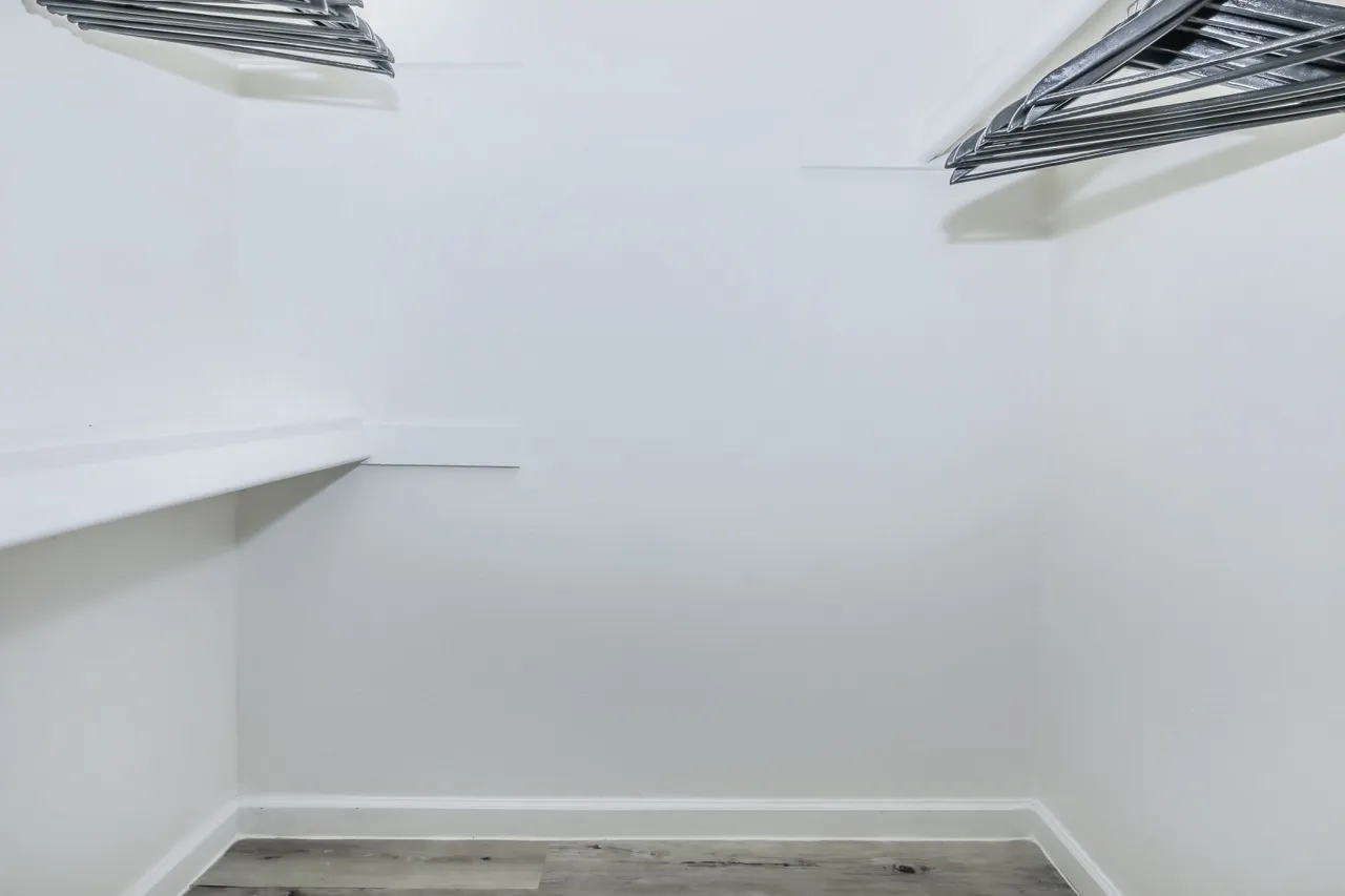 Garage interior, white drywall, recessed lighting, concrete floor