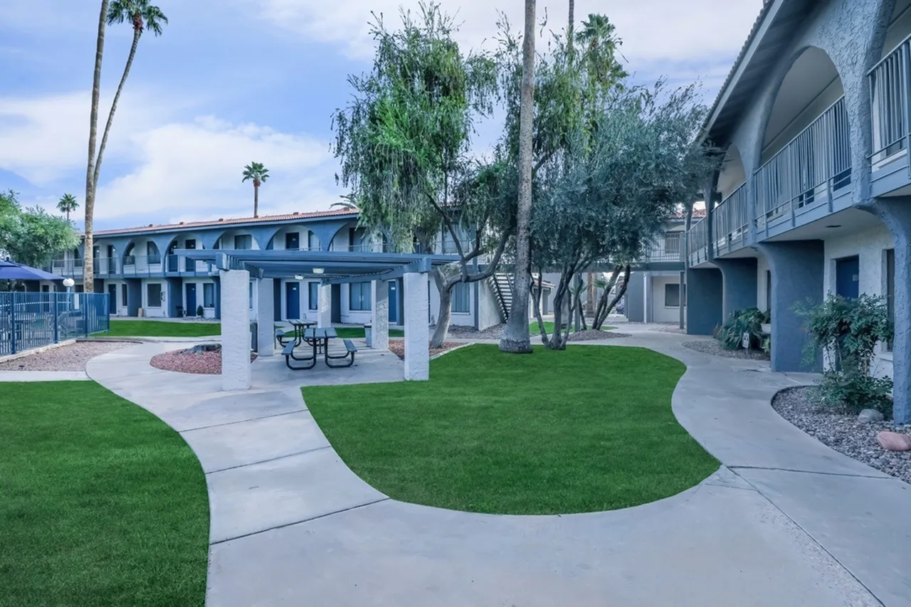 Courtyard with lawn areas, concrete pathways, picnic seating, palm trees, Rise On Country Club, Mesa
