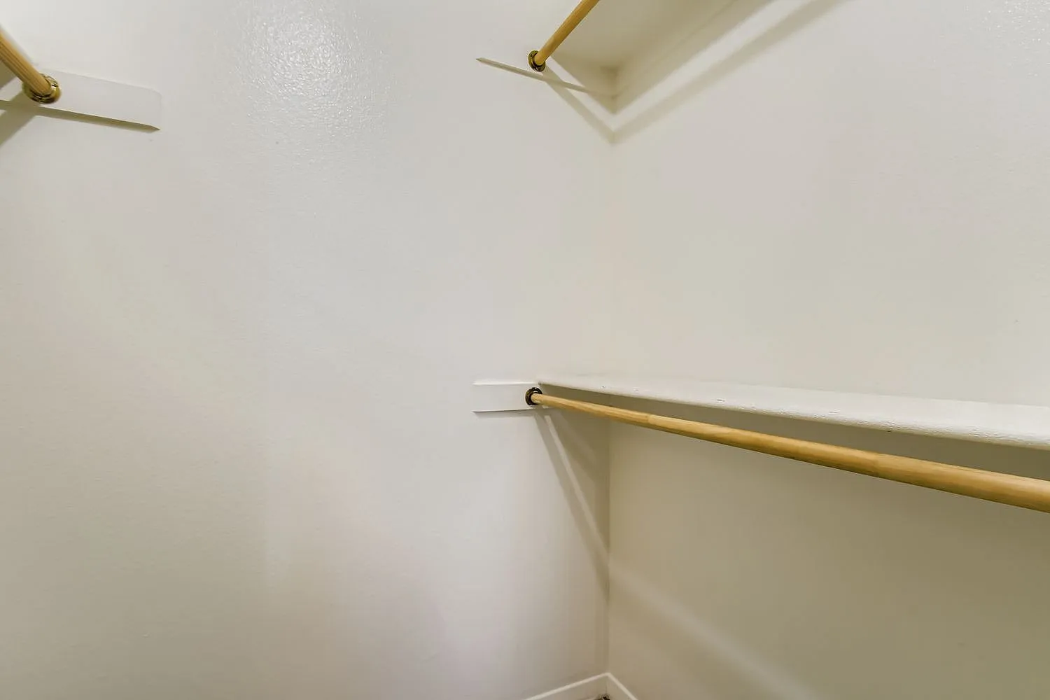 Bathroom, white walls, brass towel bar, ceiling fan