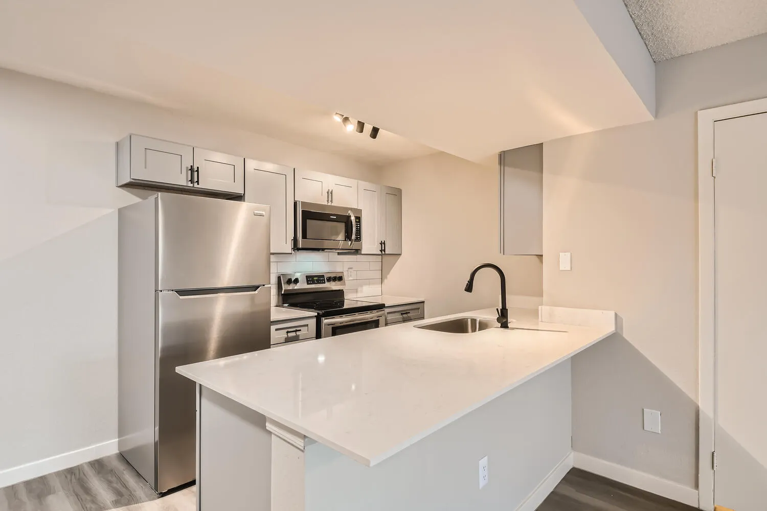 Kitchen, stainless steel appliances, quartz countertops, subway tile backsplash
