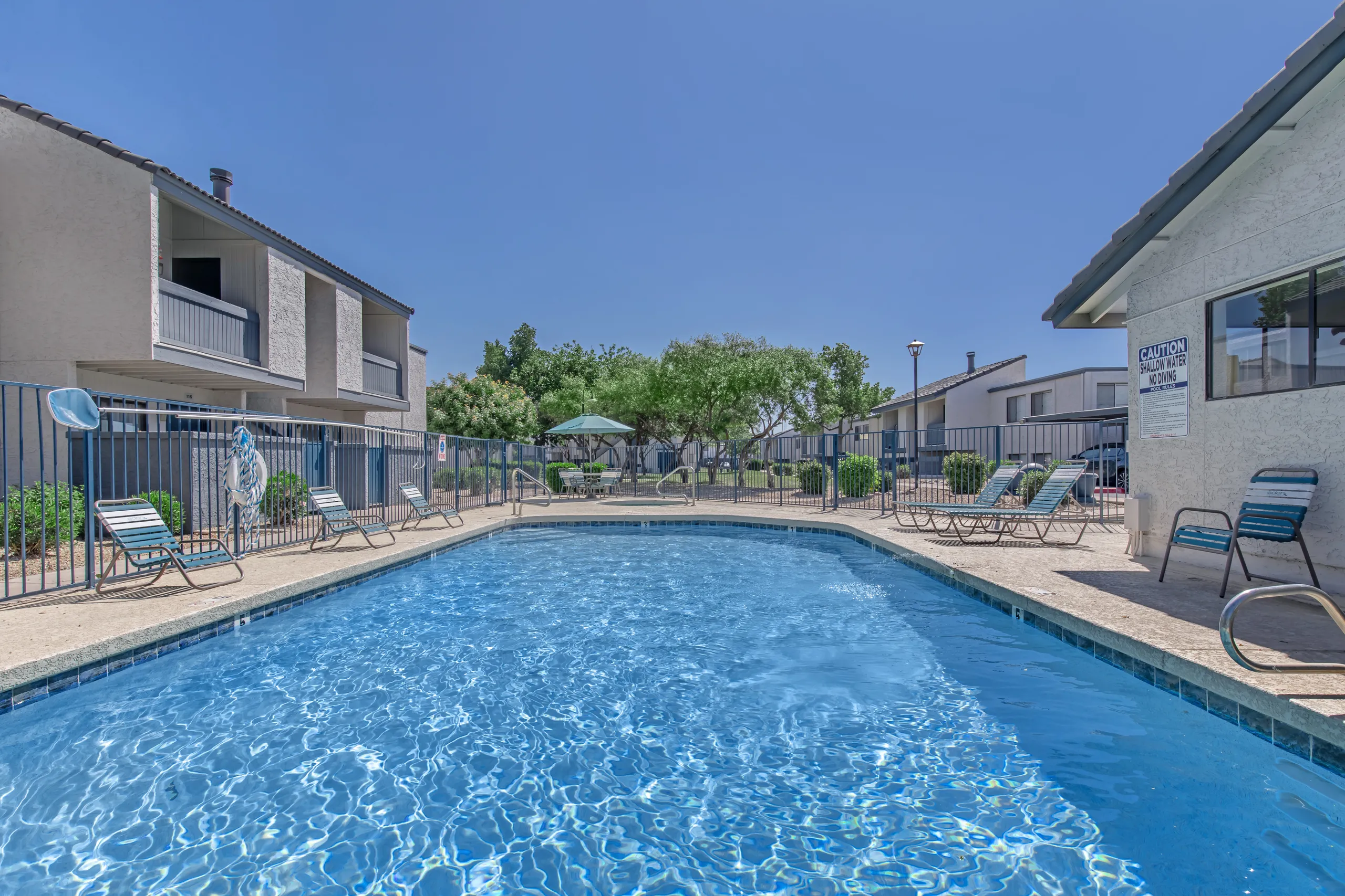 Pool deck, lounge chairs, resident courtyard views