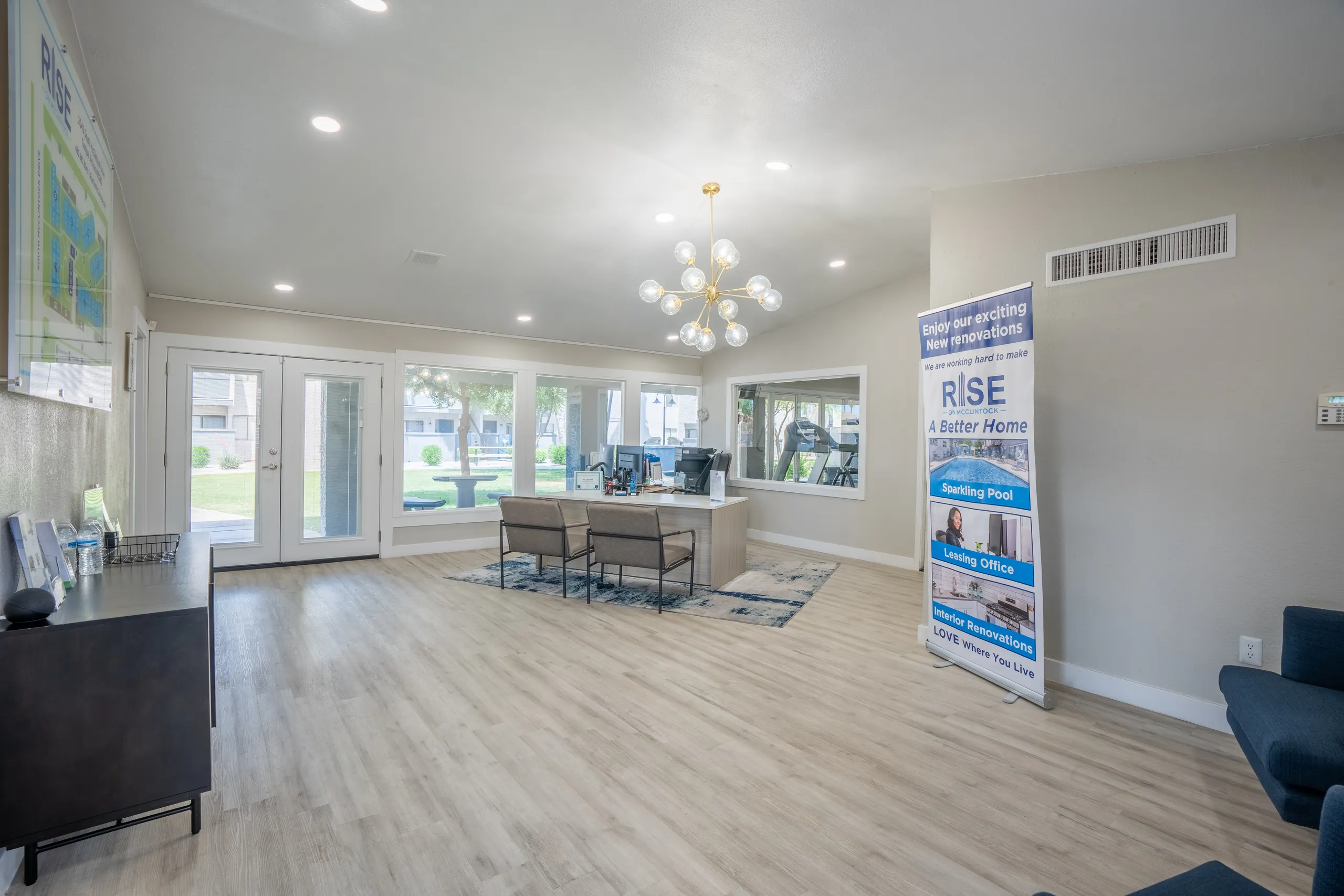 Leasing office interior, seating area, community site map display