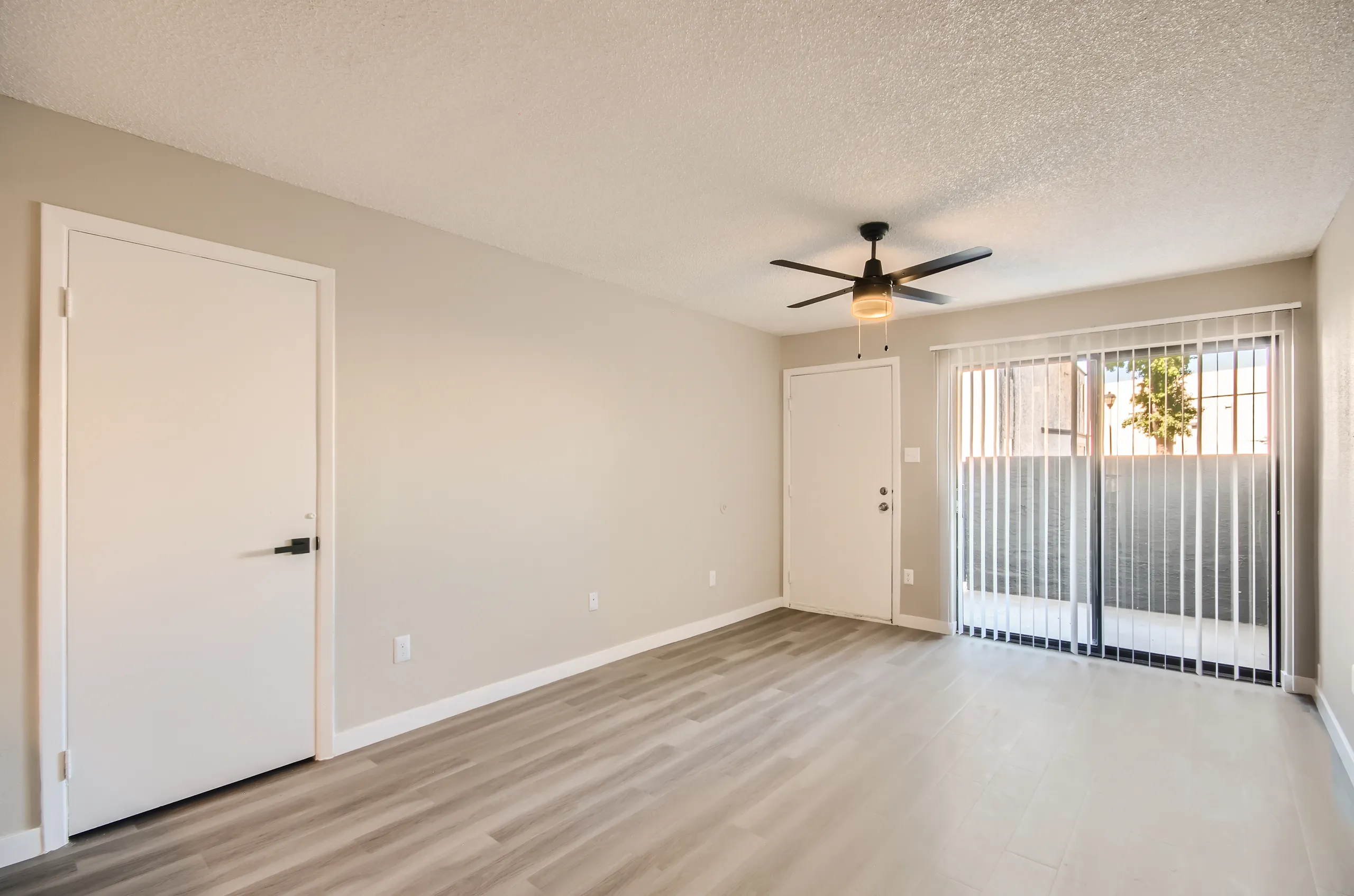 B1 Platinum living room, ceiling fan, exterior door, sliding glass door