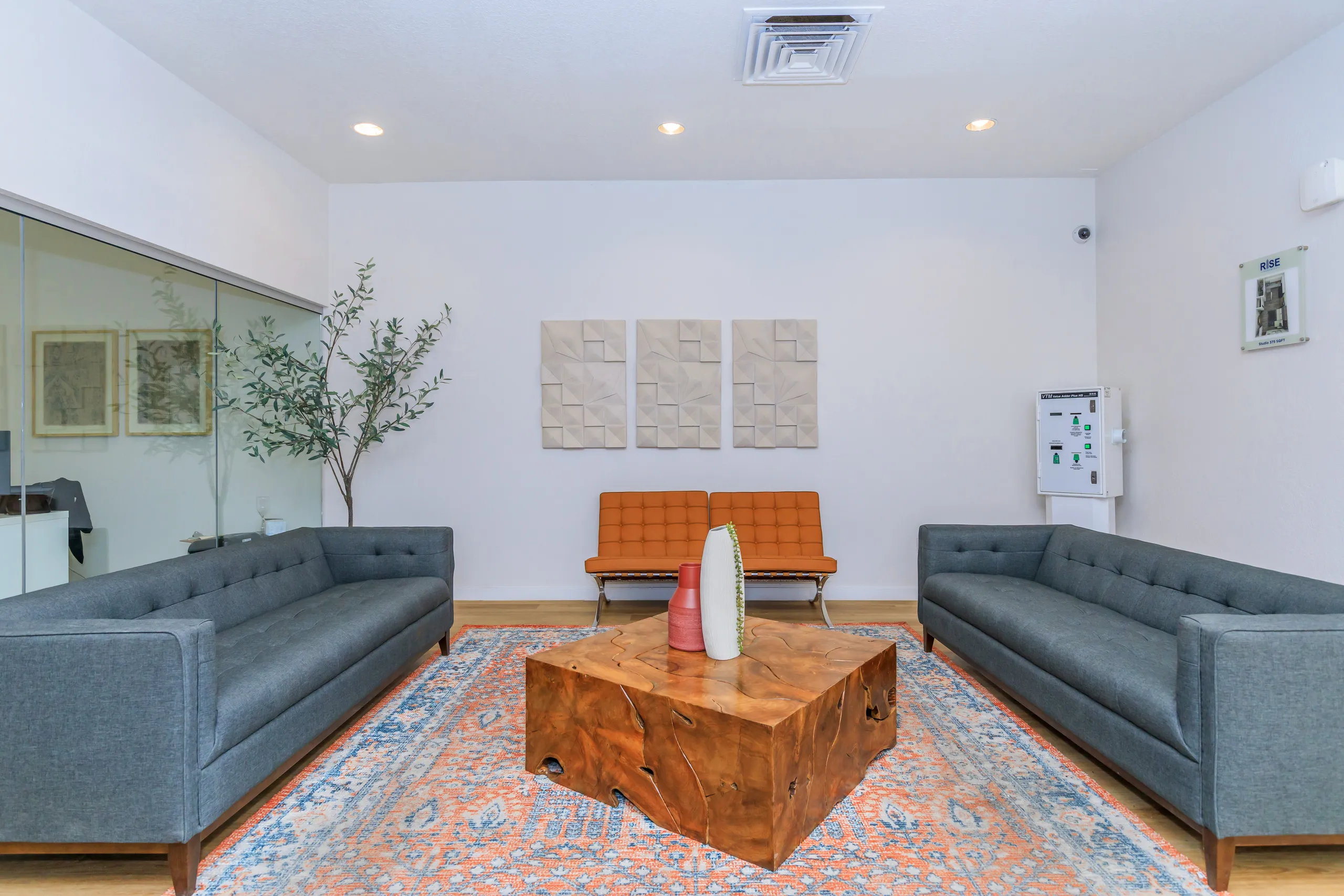 Seating area, accent chairs, wood coffee table, floor plan display