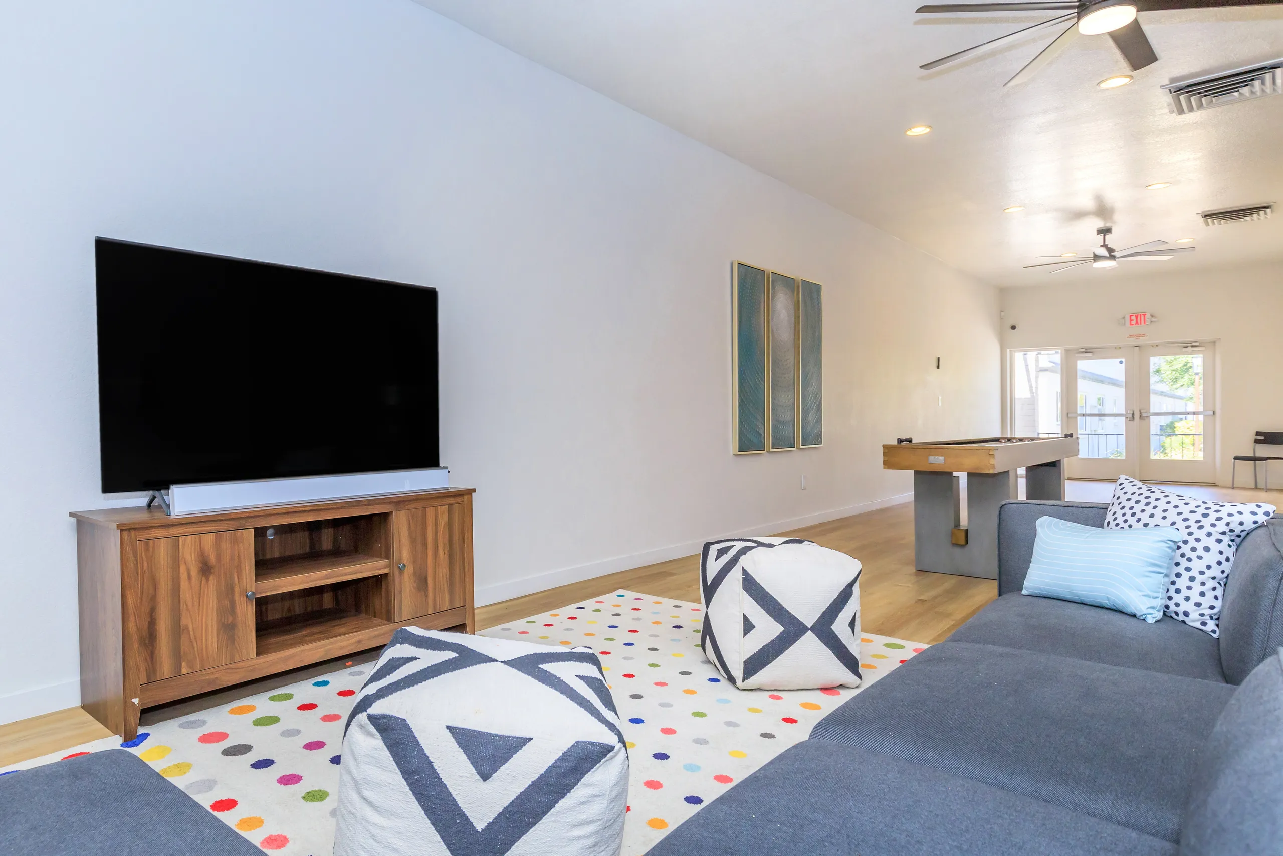 TV media console, sectional seating, game table, exterior door