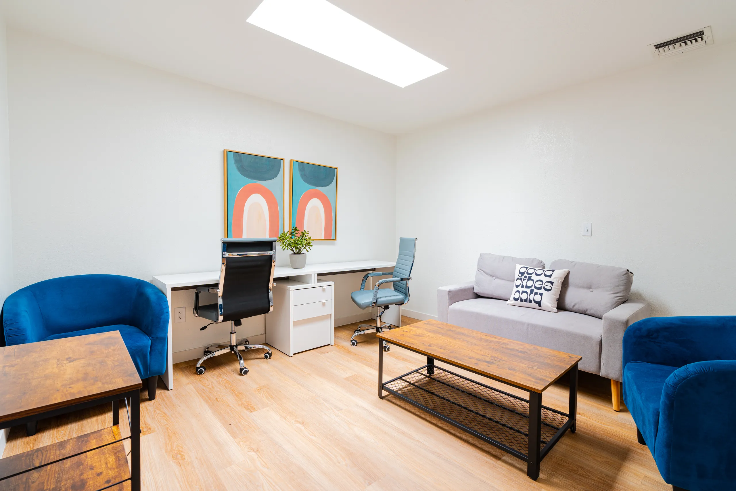 Desk workstations, office chairs, lounge seating, wall art