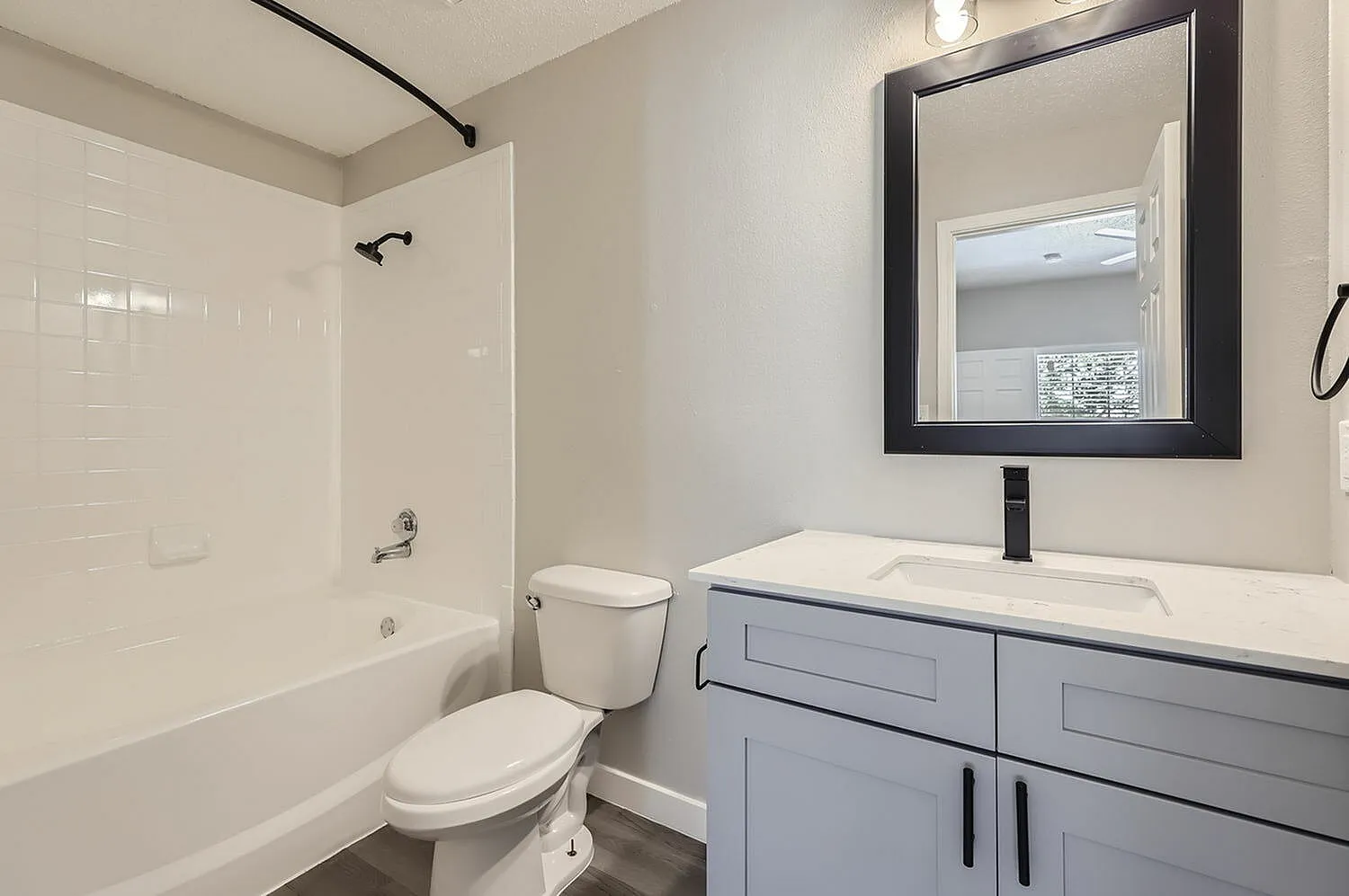 Tub shower, white vanity countertop