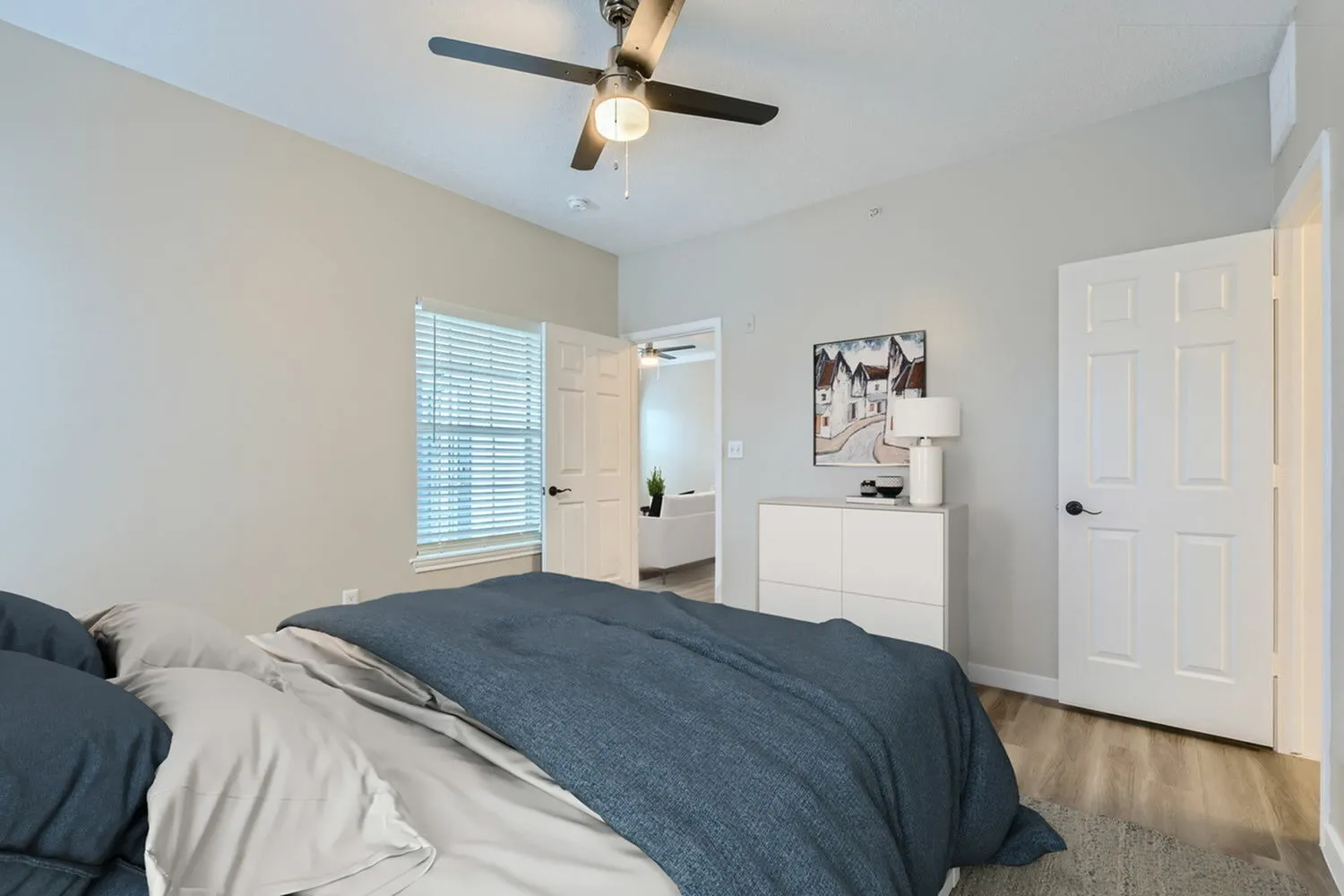 Bedroom, window with blinds, doorway to living room