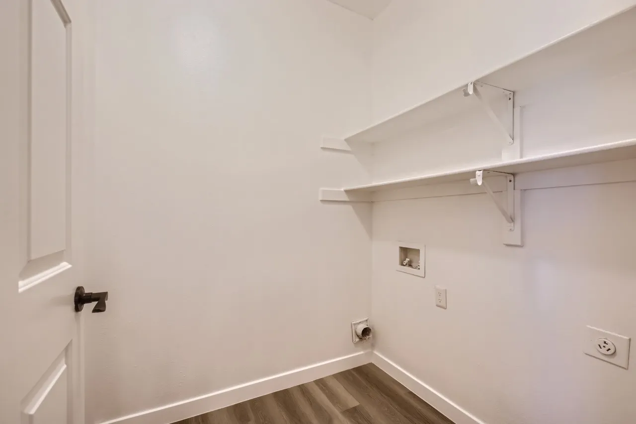 Laundry closet with shelving