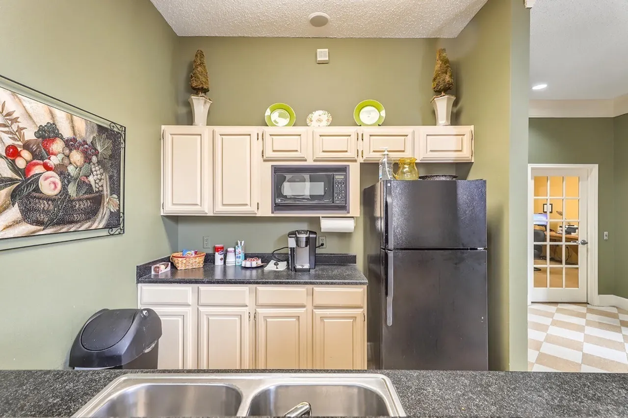 Coffee and snack bar, cabinetry, refrigerator, microwave