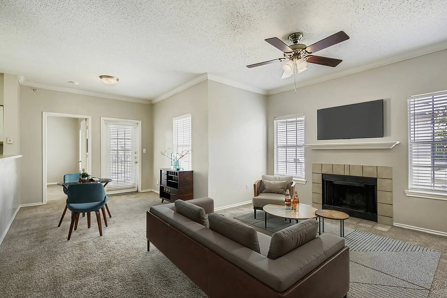 B2 Classic living room, fireplace, ceiling fan, sliding glass door