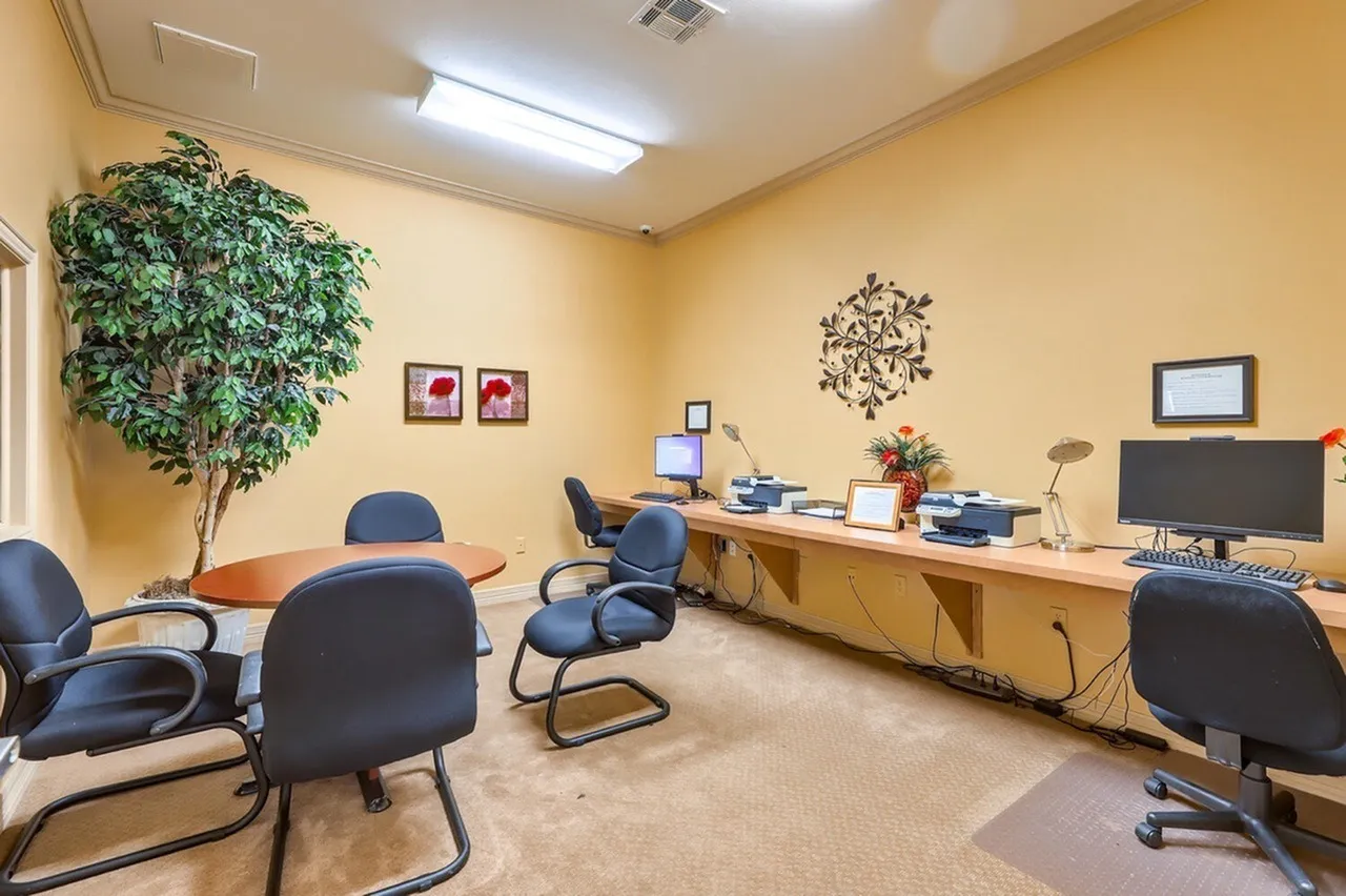 Business center, desks, office chairs, computer monitors