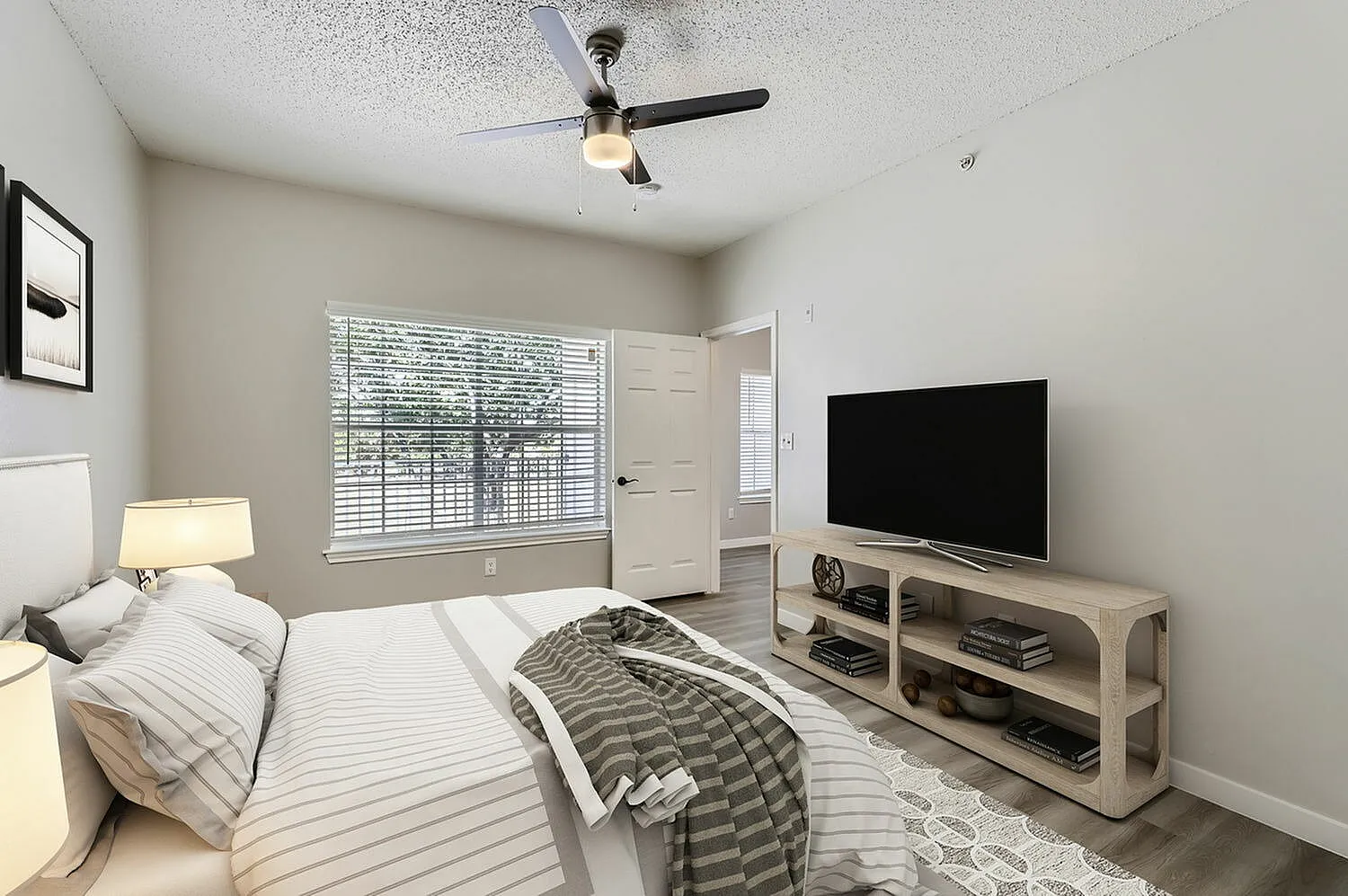 Bedroom, window with blinds, wood-style plank flooring
