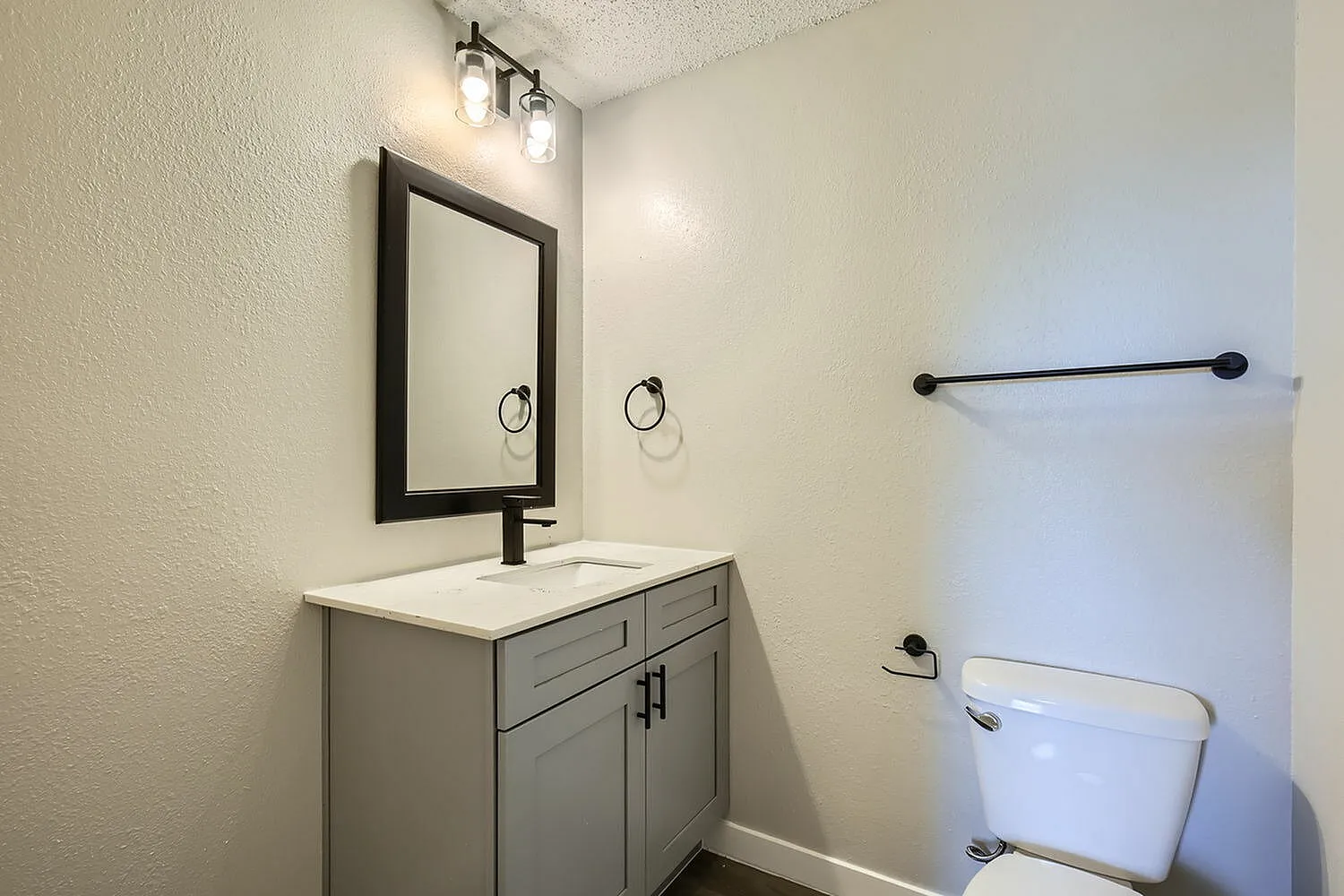 Bathroom vanity, framed mirror, black faucet