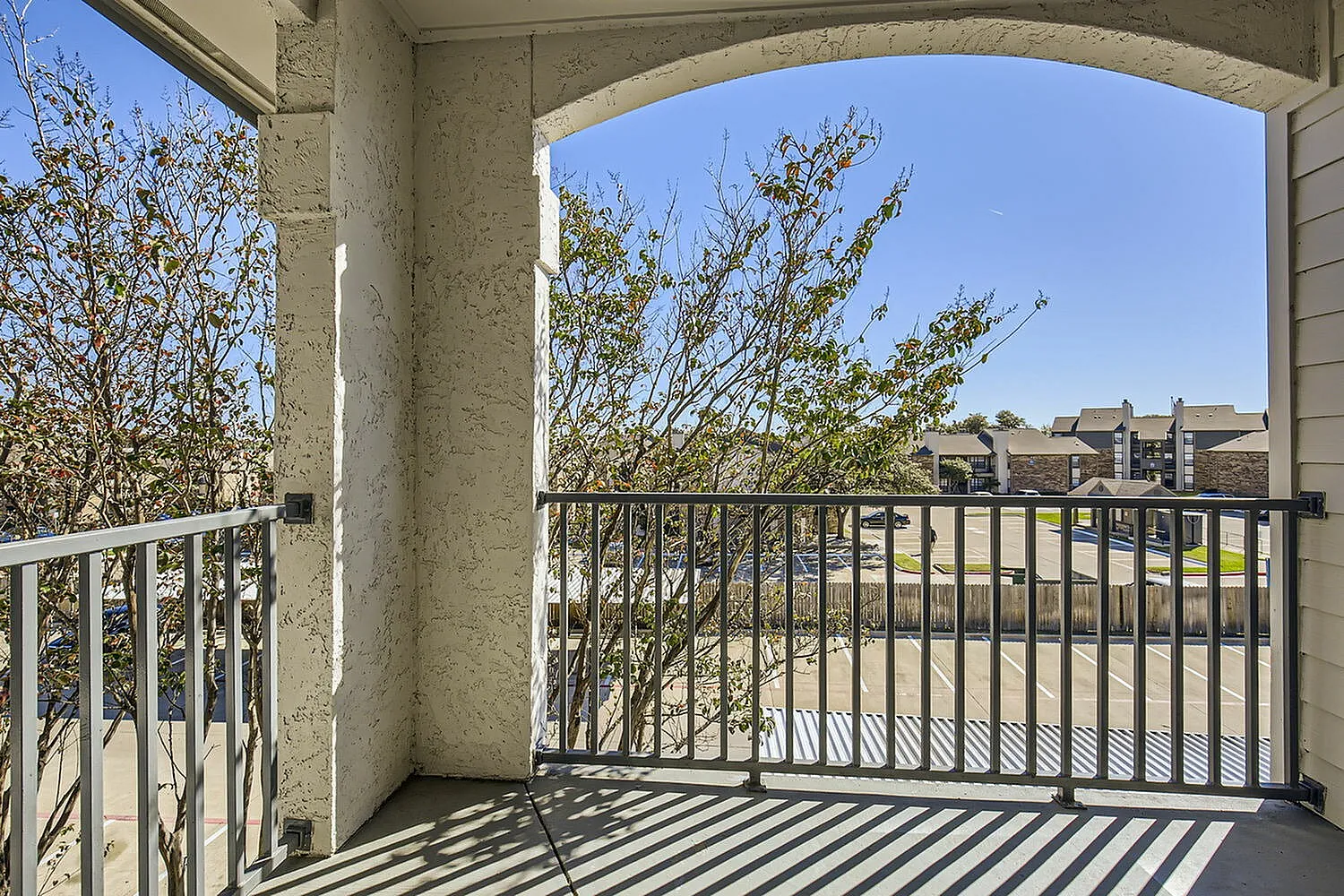 Balcony, metal railing, tree views