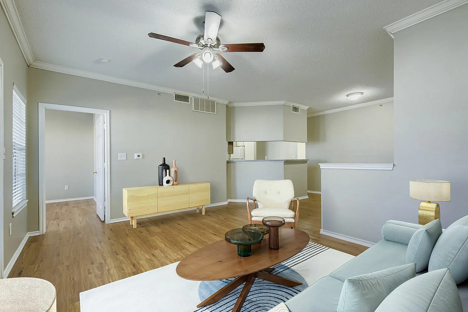 Living room, wood-style plank flooring, ceiling fan