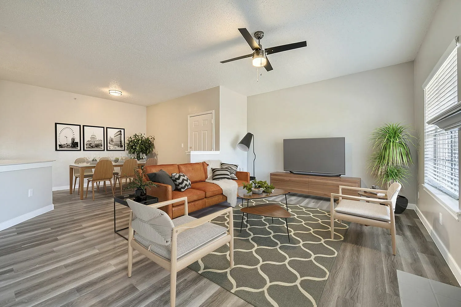 C1 Platinum living and dining area, ceiling fan, wood-style plank flooring