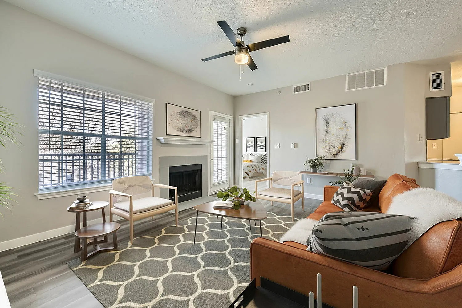 Living room, fireplace, ceiling fan, window with blinds