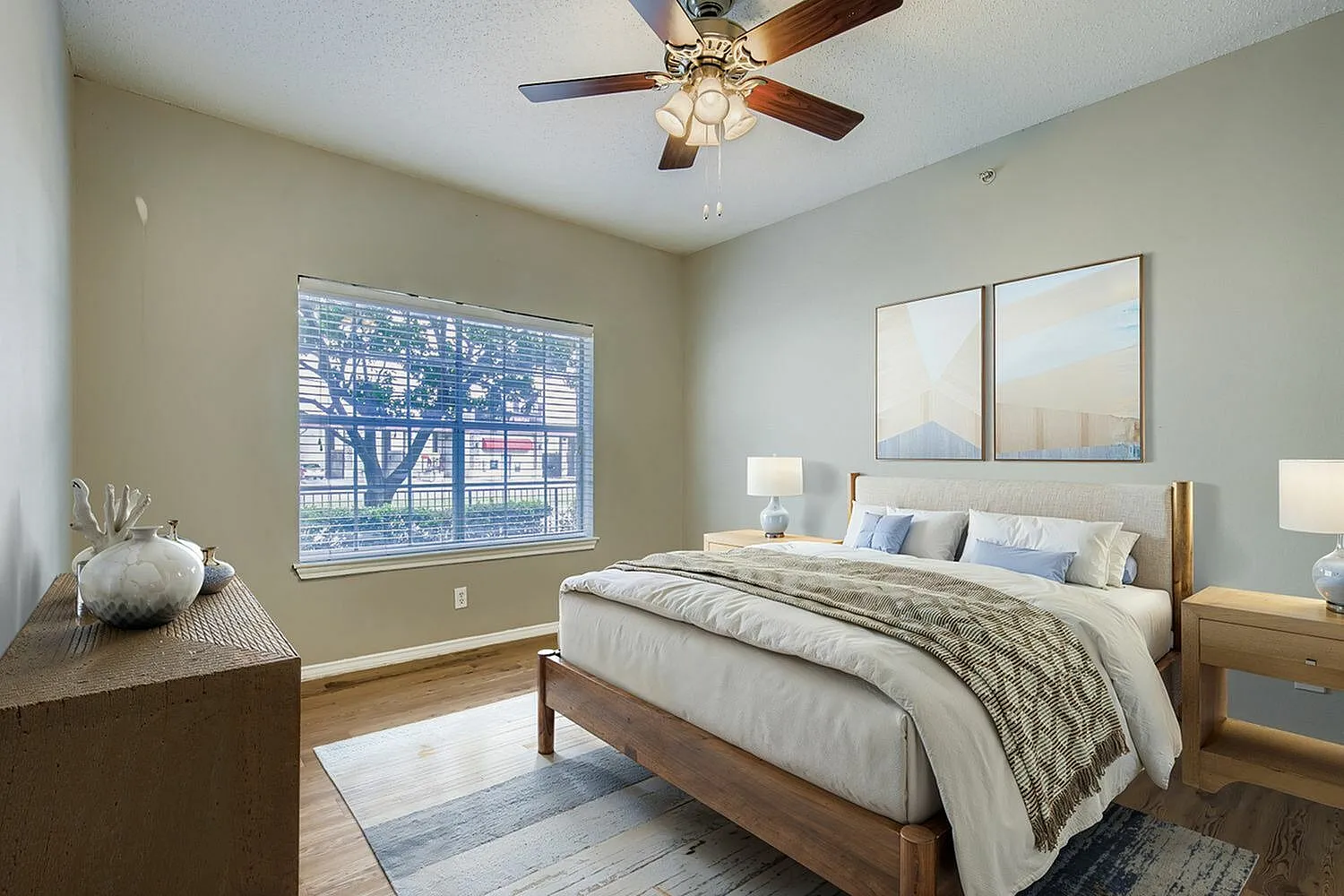 Bedroom, ceiling fan, window with natural light, neutral walls