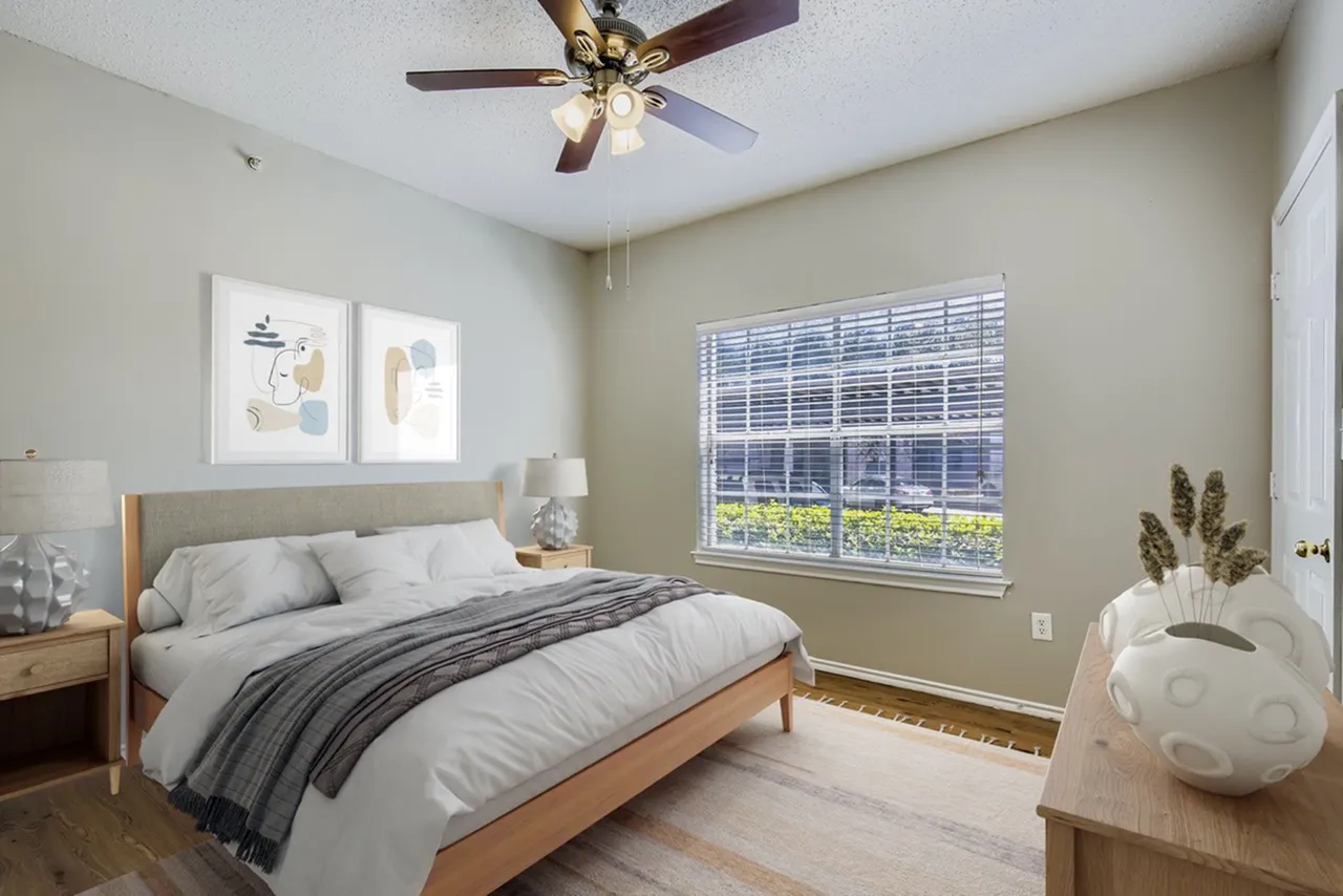 Bedroom, ceiling fan, window with blinds, wood-style plank flooring