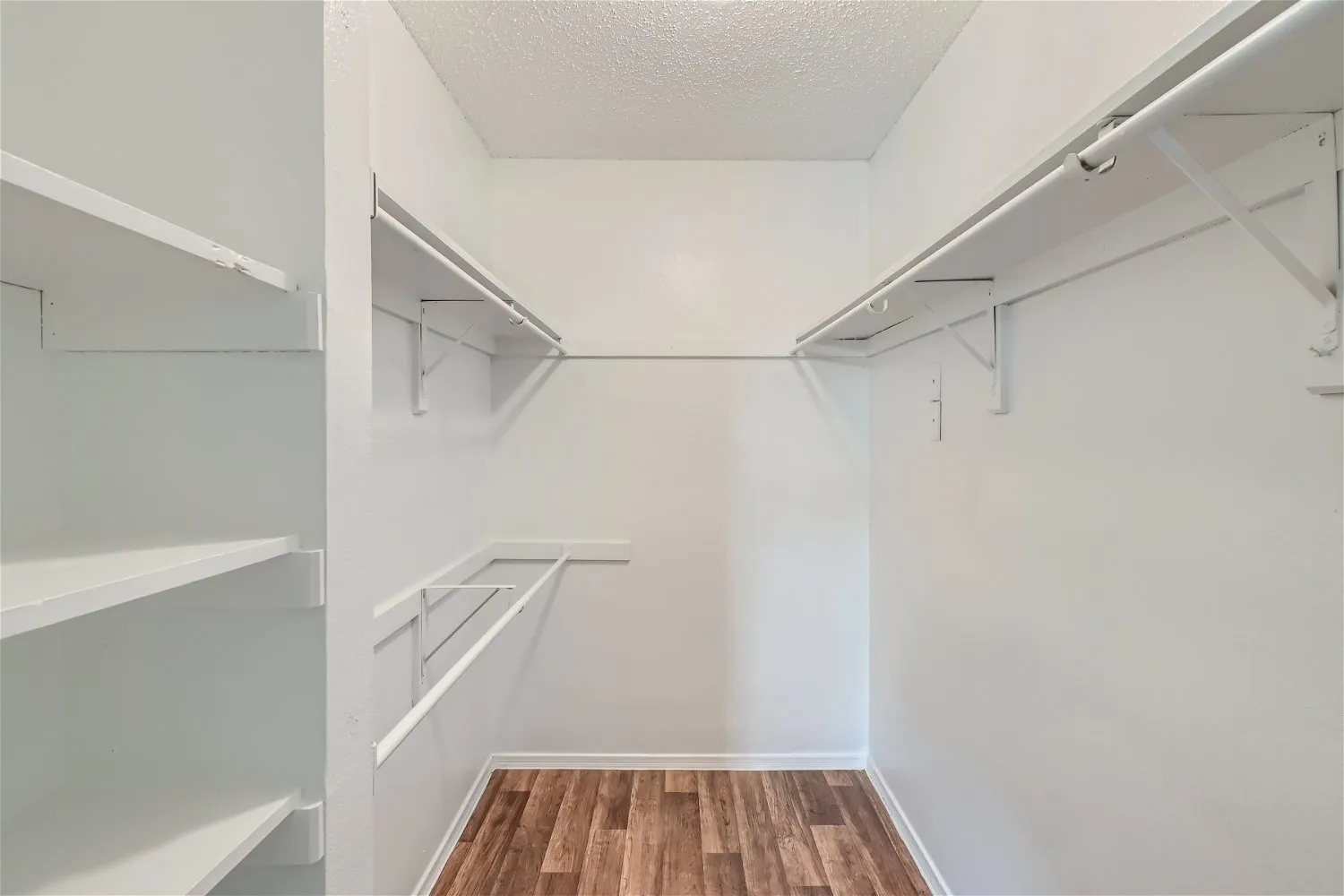 Walk-in closet, built-in shelving, hanging rods