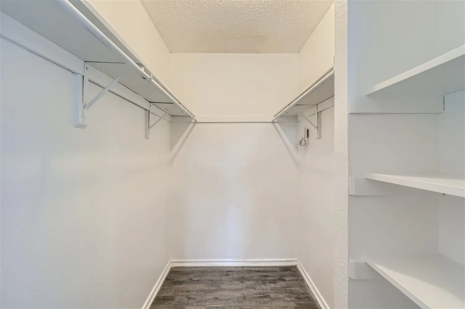 Walk-in closet, built-in shelving, hanging rods