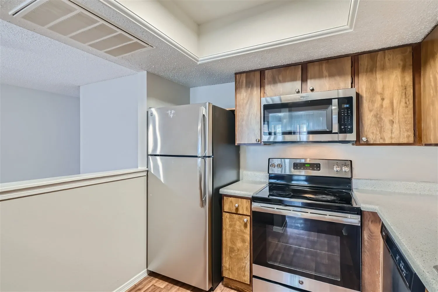 Kitchen, stainless steel appliances, wood cabinetry