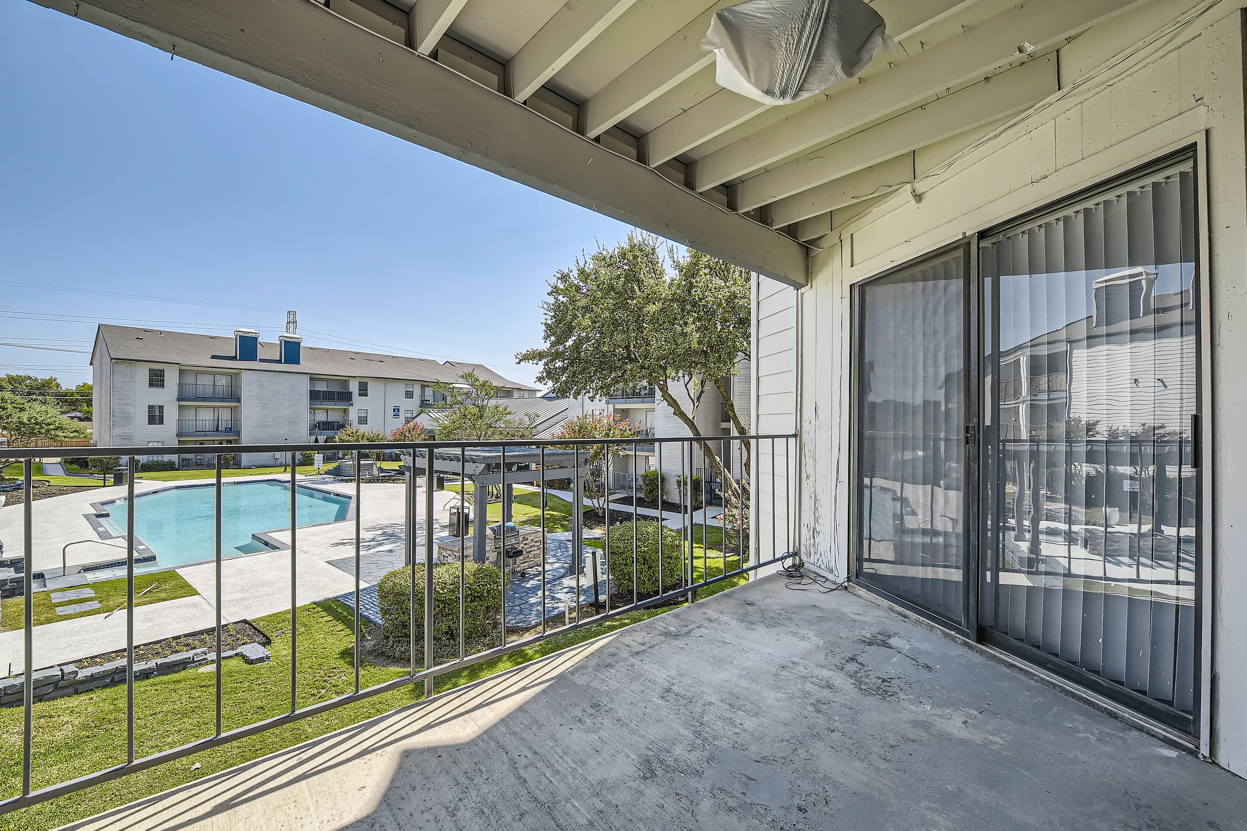 Private balcony with pool and courtyard view