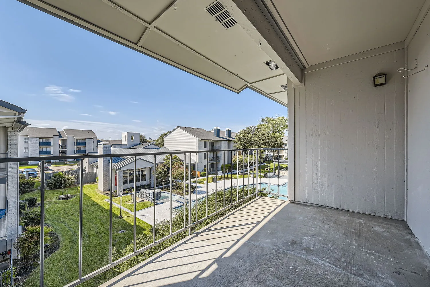 Private balcony, community pool and courtyard view