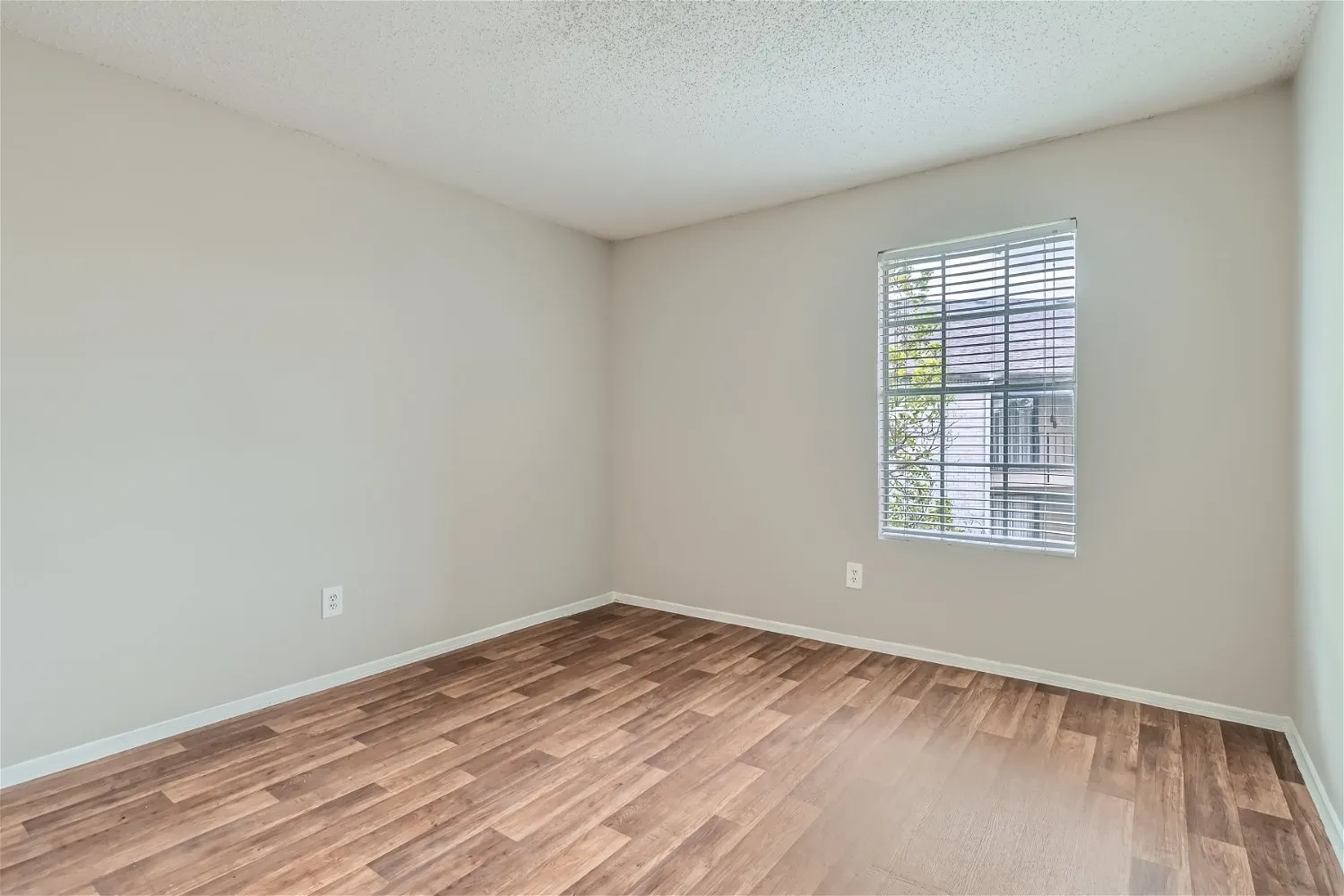 Bedroom, wood-style plank flooring, window