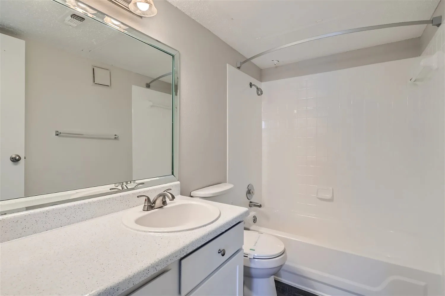 Bathroom vanity, tub and shower, mirror