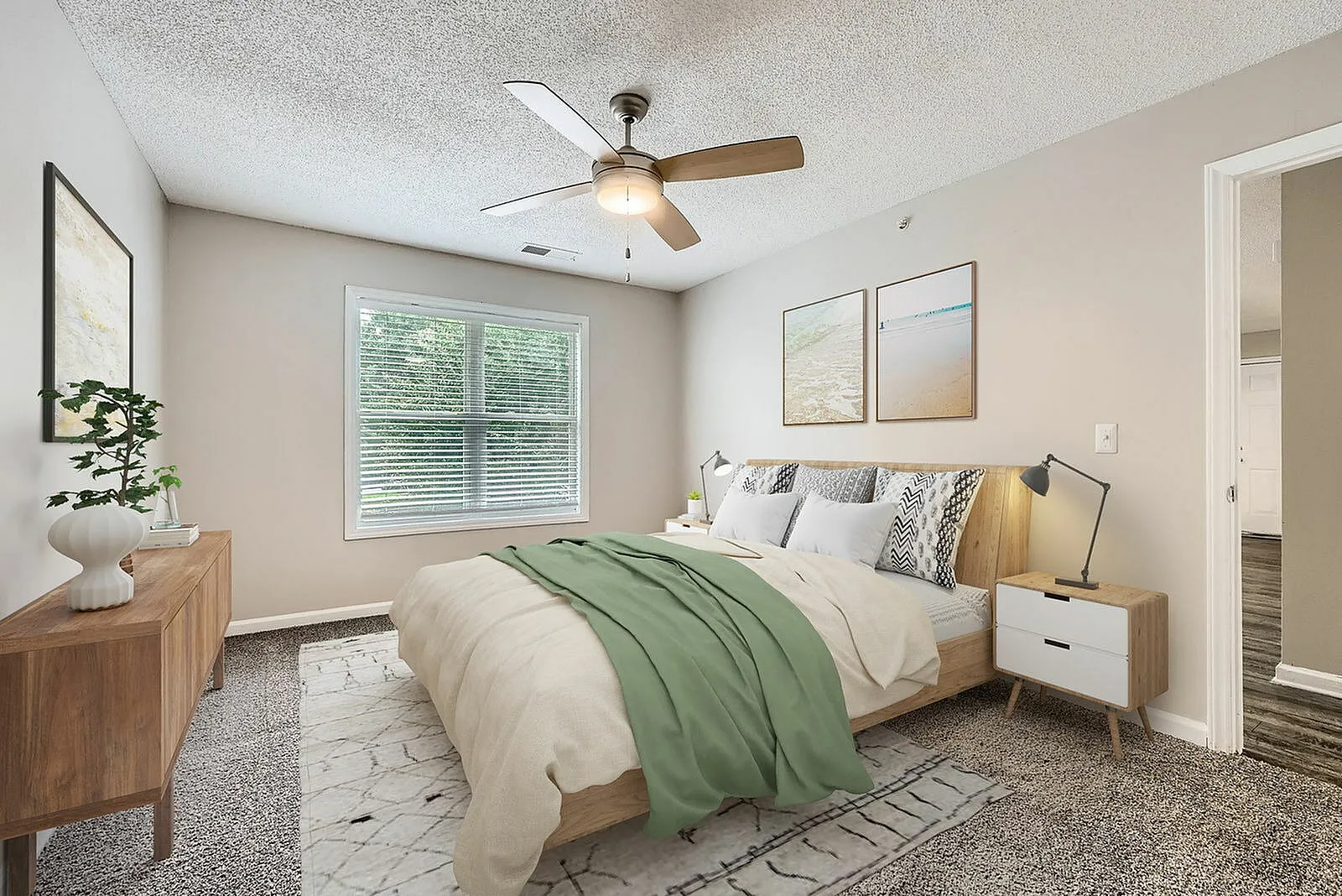 Primary bedroom, wood-style plank flooring, ceiling fan, natural light from window