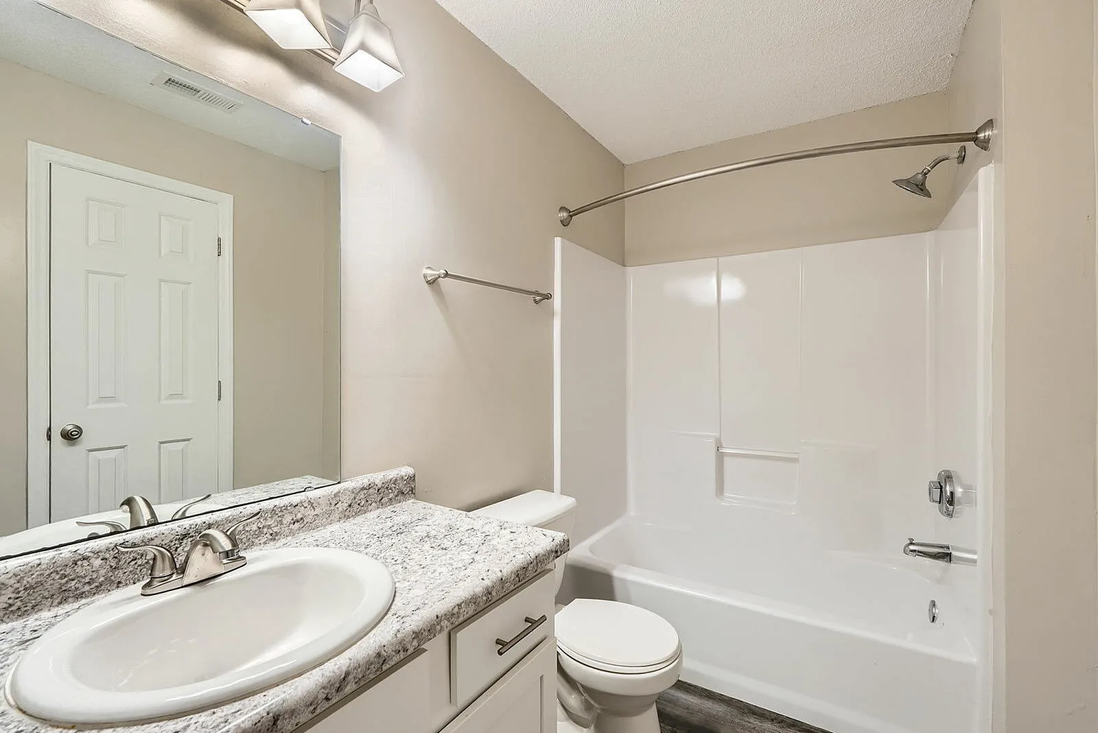 Primary bathroom, granite countertops, round undermount sink, chrome fixtures