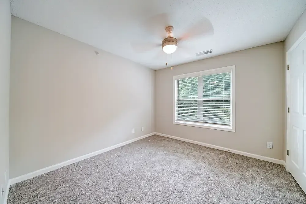 Bedroom, gray carpet flooring, ceiling fan, double-hung window