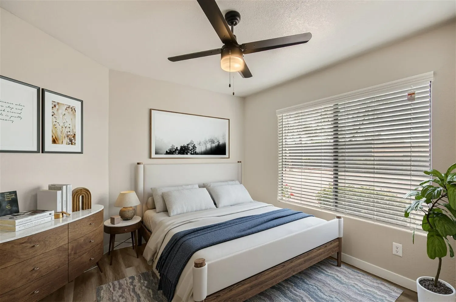 Bedroom, ceiling fan, large window with horizontal blinds, light gray walls