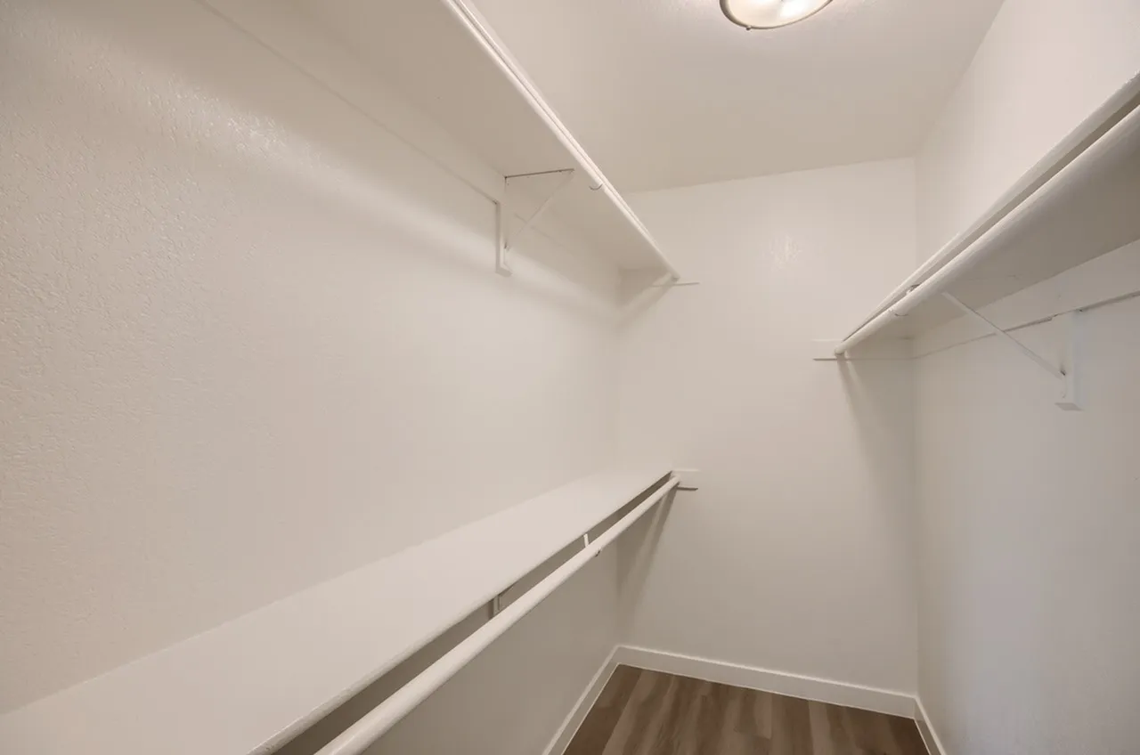 Walk-in closet, built-in shelving, hanging rods