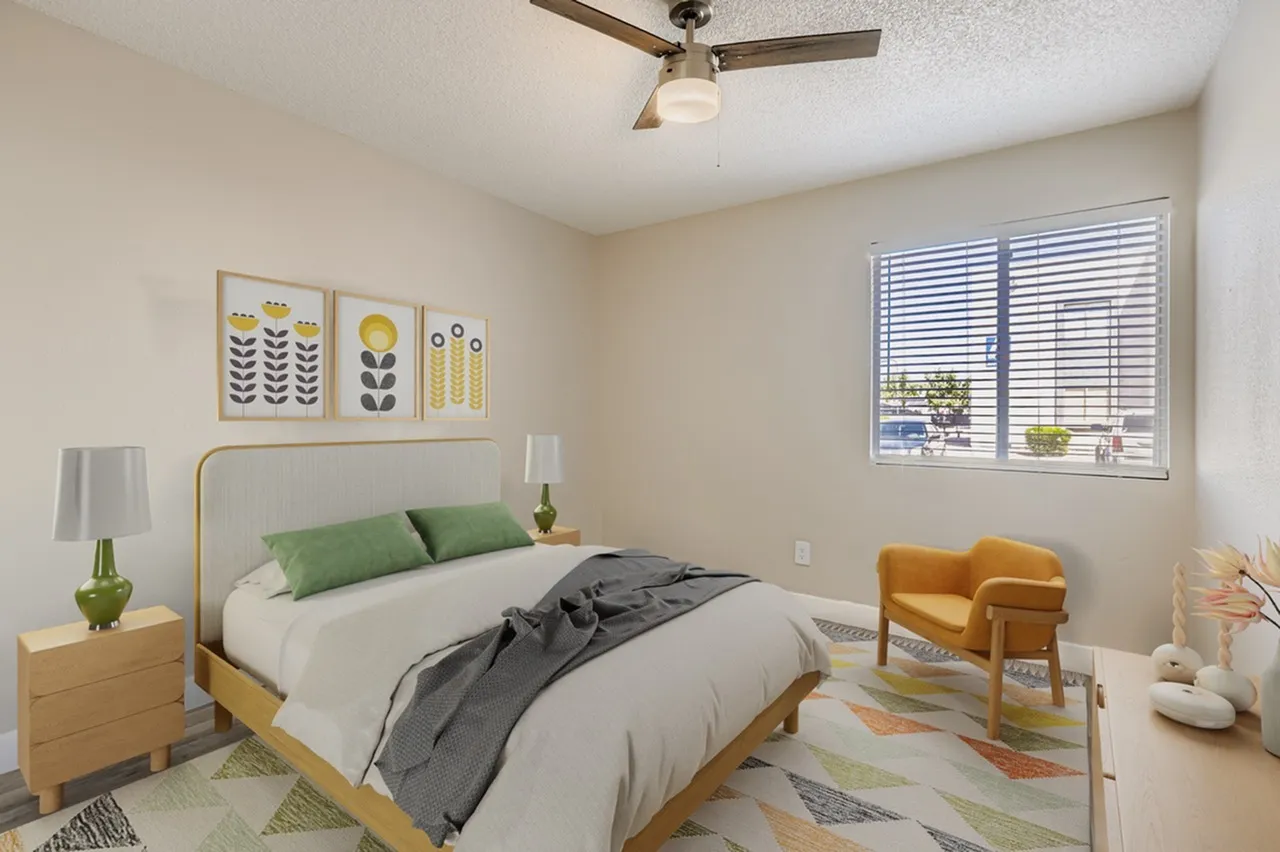 Primary bedroom, wood-style bed frame, green and white bedding, ceiling fan, plantation shutters, wood-style nightstand