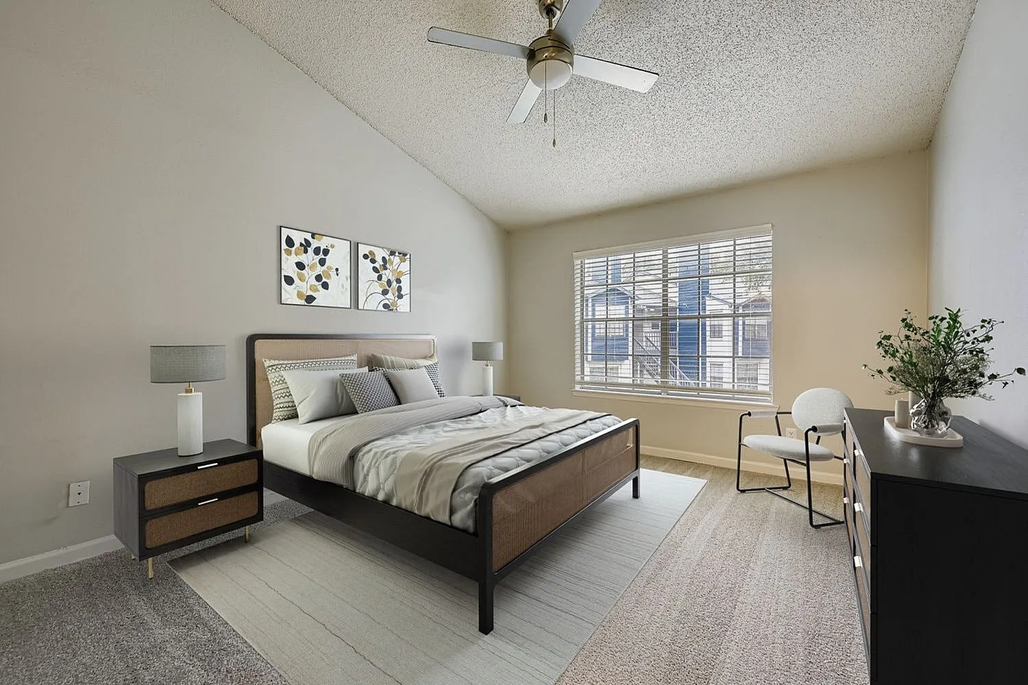 Primary bedroom, wood-style plank flooring, ceiling fan, large window with shutters