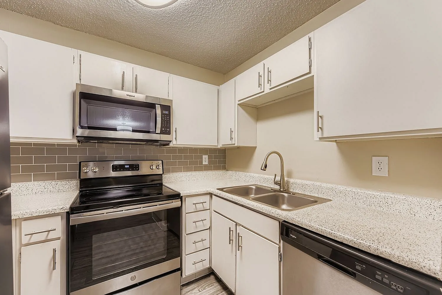 Kitchen, white shaker cabinetry, quartz countertops, stainless steel appliances, subway tile backsplash