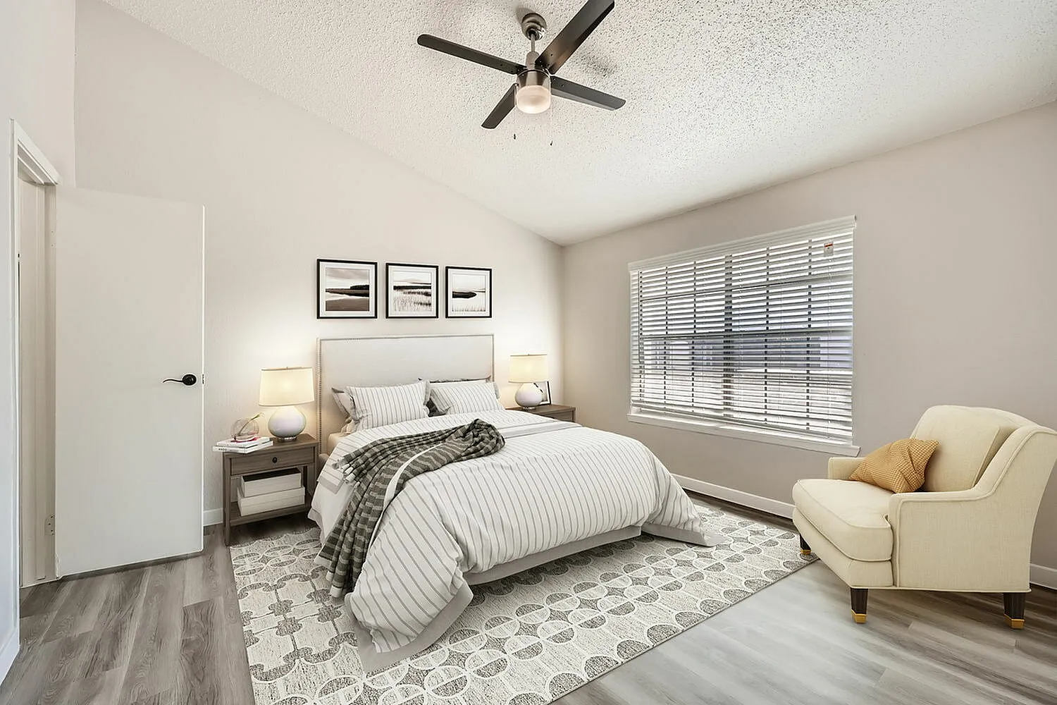 Primary bedroom, wood-style plank flooring, striped bedding, ceiling fan, shutters